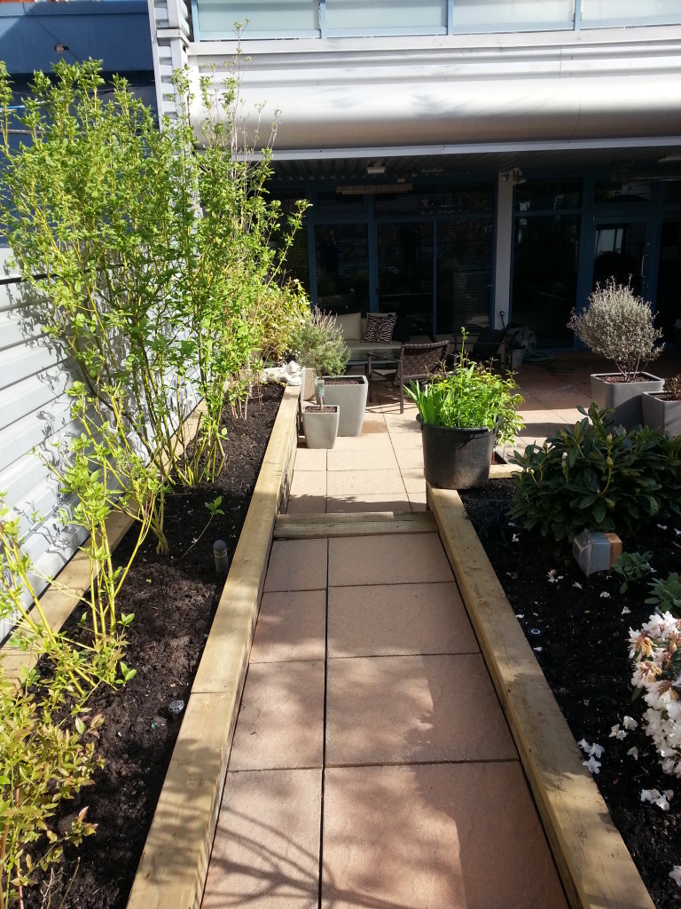 Brushed steel aluminum bulk heads and garden foot paths restored after SPM service